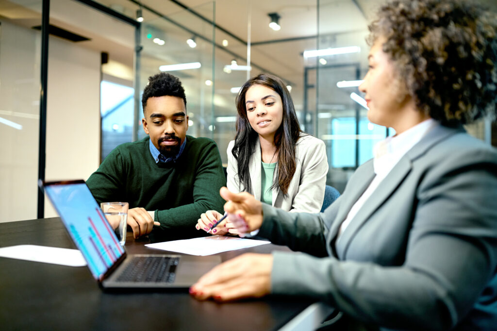 Financial professional working with clients in an office setting