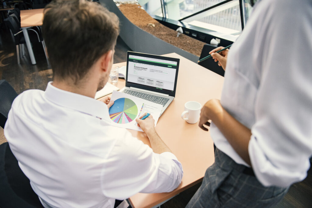 Financial Professional sitting at desk reviewing the Guaranty Guidepath FIA website and financial stats