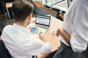 Financial Professional sitting at desk reviewing the Guaranty Guidepath FIA website and financial stats