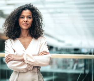 Woman standing confidently with her arms crossed