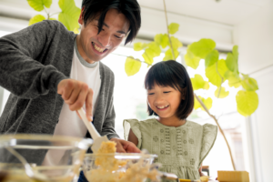 Man and child baking together and having quality family time